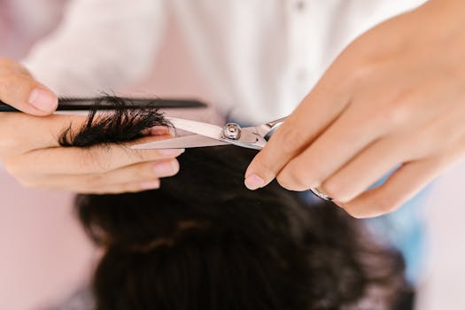 stylist demonstrating hair styling techniques