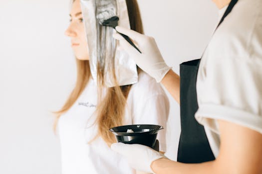 A stylist capturing a video of a hair treatment process