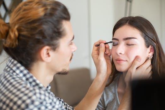 a stylist providing a facial treatment