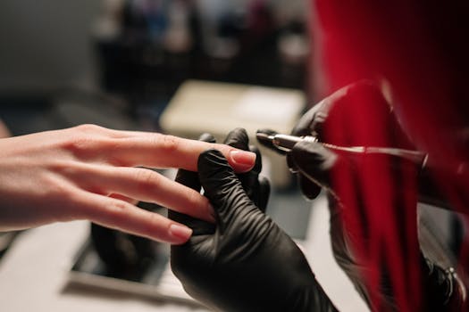 nail technician providing a manicure