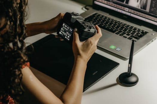 photographer editing hair styling images on a computer