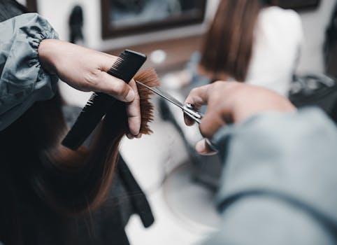 hair stylist demonstrating a technique